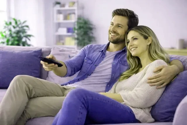 A family watching Stryvix4K on the living-room television